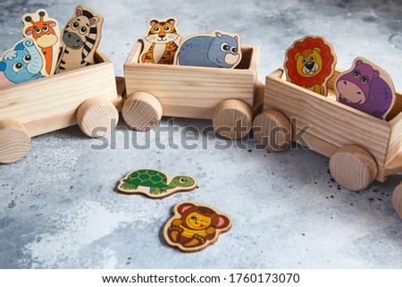 Children's wooden toys. Children wooden train with wagons. Natural wood construction set. Educational equipment. Noah's Ark Royalty-Free Stock Photo #1760173070