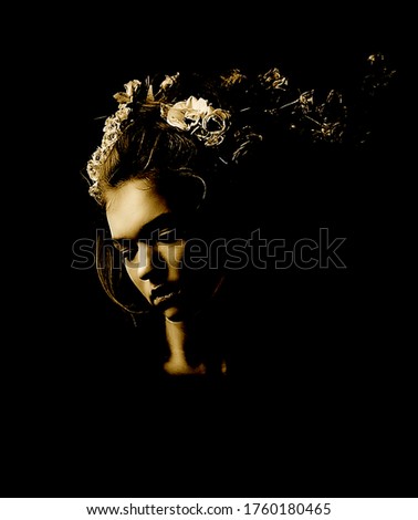The facial features of a young girl on a black background in the Studio. Photos in the style of the low key, with the effect of a poster.