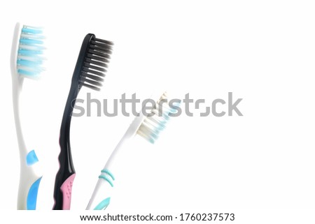 A picture of white and black toothbrushes for black lives matter concept.