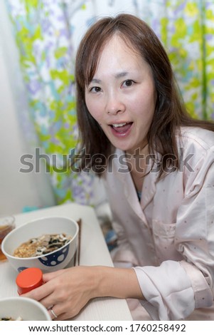Woman eating New Year's soba at home