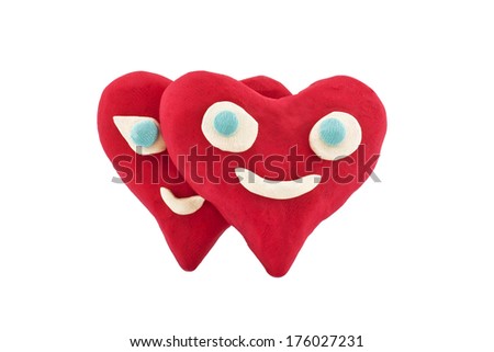 a pair of lovers plasticine hearts isolated on white background