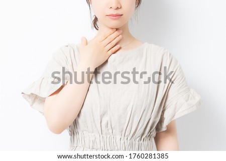 Young woman with a sore throat Royalty-Free Stock Photo #1760281385
