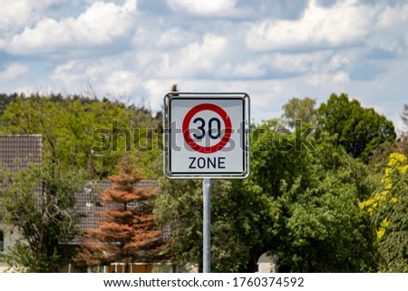 German road sign zone 30 km / h in a rural area, outdoors