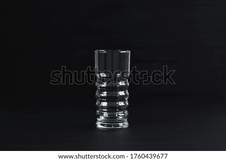 Empty Glass Stands on Black Background