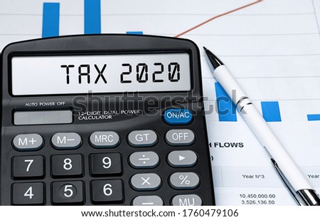 Word TAX 2020 on calculator. Business and tax concept. Stock photo