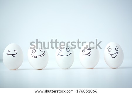 Line of Easter eggs with different facial expressions 