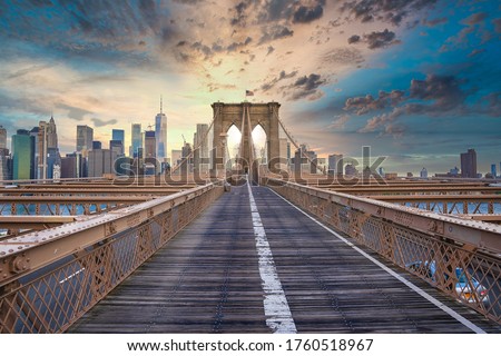 Magical sunset view of the Brooklyn Bridge. Empty bridge with no people  during lockdown in New York, USA.