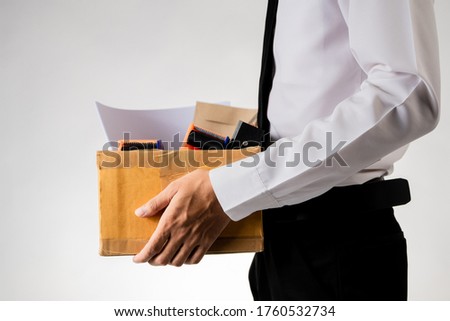 an unemployed person holds the document box. Unemployment in the COVID Virus Crisis 19. The business Failure Crisis was laid off from unemployment. Royalty-Free Stock Photo #1760532734