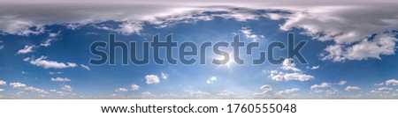 blue sky with beautiful fluffy cumulus clouds. Seamless hdri panorama 360 degrees angle view without ground for use in 3d graphics or game development as sky dome or edit drone shot