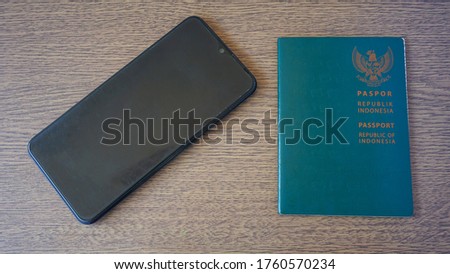 Close up of smartphone and passport