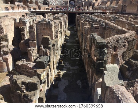 Close-up photo of the ruins of the underground spaces of a historic arena located in the city of Rome, Italy.