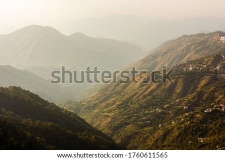 A spectacular view of the green mountain ridges surrounding the town of Shimla.