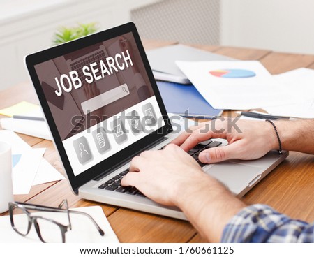 Hiring Website Concept. Closeup of man looking for open vacancies on job search site, using pc, typing