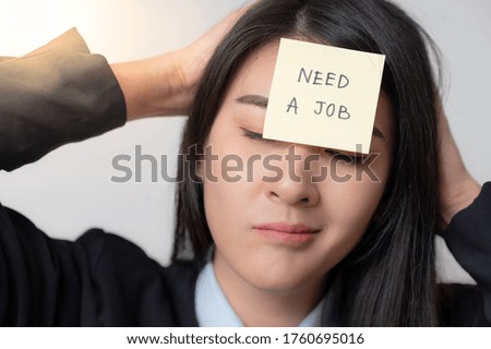 women holding need a job text on paper note pad. Jobless concept.