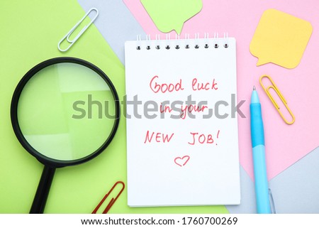 Text Good Luck In Your New Job on paper with loupe and pen
