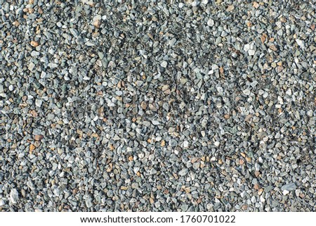 Top view of small stone floor surface texture.