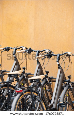 New elegant bicycles on display, detail against the wall