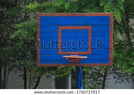 Basketball wooden backboard with a ring on an indoor yard. Background