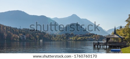 Lake Grundlsee in the early autumn morning. Village Grundlsee, region Salzkammergut, Liezen district of Styria, Austria, Europe.