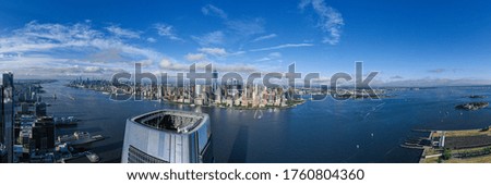 Aerial panorama of New York City skyline with both downtown Manhattan