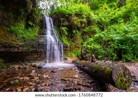 Silky waterfall in maspie den, Falkland, fife, Scotland, UK. Royalty-Free Stock Photo #1760848772