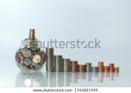 Stack of coin on white table bank concept, selective focus