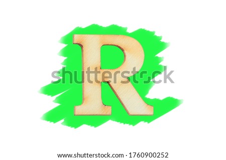 Alphabet letter wooden font on painted green color isolated on white background. English flat wood character R.
