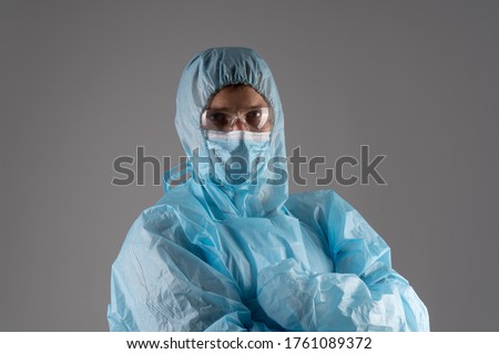 Doctor in full protective suit.