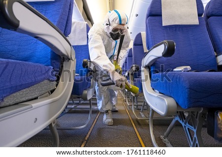 Airline plane deep cleaning  for coronavirus (Covid-19) prevention. Royalty-Free Stock Photo #1761118460