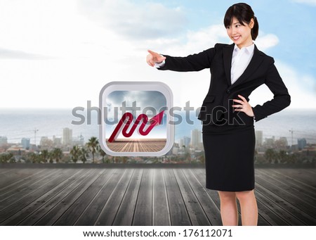 Smiling businesswoman pointing against ocean scenic view