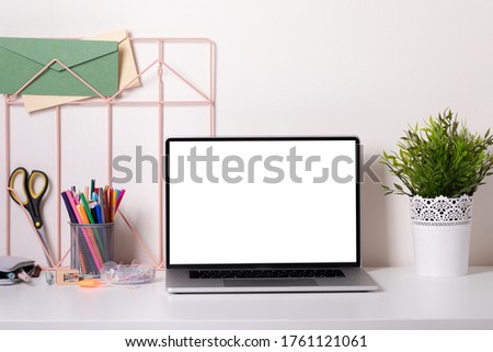 School desk in modern style with laptop on white background. Home education.Modern decor. Mock up.