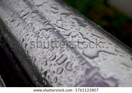 Raindrops on the metal.  Wet metal.  Silver metal.