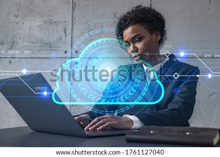 Businesswoman typing on laptop work in modern office on new project. Cloud tech drawing hologram. Double exposure. Concept of success.