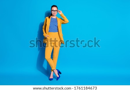 Full length body size view of her she nice-looking well-dressed attractive classy lady partner leader ceo boss chief shark posing isolated bright vivid shine vibrant blue color background