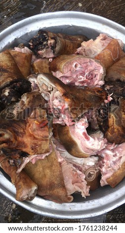 Ghanaian style of cooking goat meat. A picture of the first stage. The meat is roasted to clear all hairs and chopped.