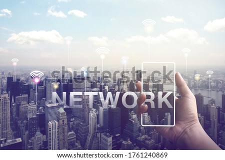 The Internet network connection technology in the city space with out of focus building in NewYork city, Dark color sky background with network signs. Creativity ideas concept.