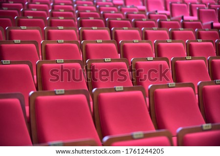 Empty red seats with number in cinema. Korean text in picture is 'ba"