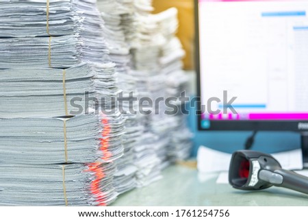 Using scanner machine for convert document to digital data storing into computer, Stacks of paper, piles of unfinished documents, Business report papers. Royalty-Free Stock Photo #1761254756