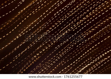 Pattern of moving light on a dark background