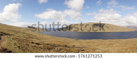 Trælanípa Slave Cliff and Leitisvatn Lake mountain landscapes in the Faroe Islands of Denmark.