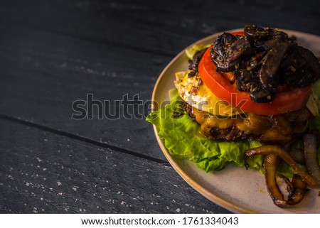 Bunless burger gluten free beef onions mushroms dark flat lay food egg