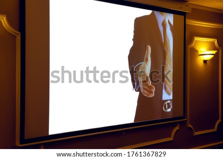Screen with business image for inscription or logo in interior of seminar or conference with business concepts. Hall conferences, business meetings. White insulation background projection screen