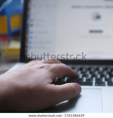 image of male hands on laptop keyboard