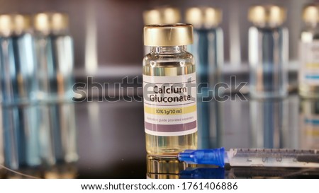 Vial of Calcium Gluconate stainless steel background Royalty-Free Stock Photo #1761406886