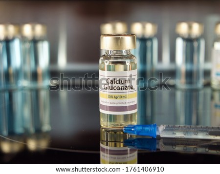 Vial of Calcium Gluconate on a stainless steel background Royalty-Free Stock Photo #1761406910