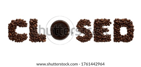 the word "closed" is lined with coffee beans, isolated on a white background