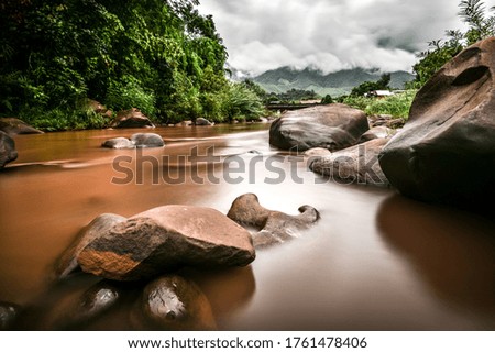 low speed shutter of water running in small river in Nan , Northern of thailand was taken on Jun 15 ,2020