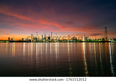 Oil refinery plant from industry, petrochemical oil and gas refinery and pipeline industry with sunrise sky background.