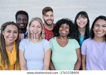 Happy multiracial friends laughing - Group of young peoples having fun together - Concept of no racism  Royalty-Free Stock Photo #1761538604