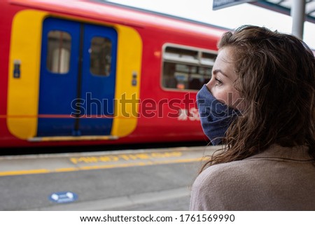 Wear a mask on the train coronavirus uk travel rail railway transport public Royalty-Free Stock Photo #1761569990